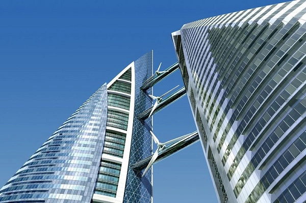Trung tâm thương mại World Trade Center, Bahrain: Với hai tòa tháp được nối bằng 3 cây cầu, trung tâm thương mại World Trade Center ở Bahrain là cao ốc đầu tiên trên thế giới có các tuabin gió trong thiết kế. Tòa nhà hình cánh buồm này có thể tạo ra điện nhờ sức gió, với chi phí xây dựng là 150 triệu USD. Ảnh: Amusing Planet.