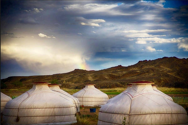 Mongolia, No. 15 on the Places to Go in 2013 list A rainbow peeks through the clouds before nightfall at our ger camp.  — John Clark, St. Louis, Mo. (Submitted Aug. 8)